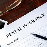 a dental insurance form next to an X-ray image