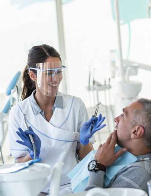 a dentist performing dental implant salvage treatment